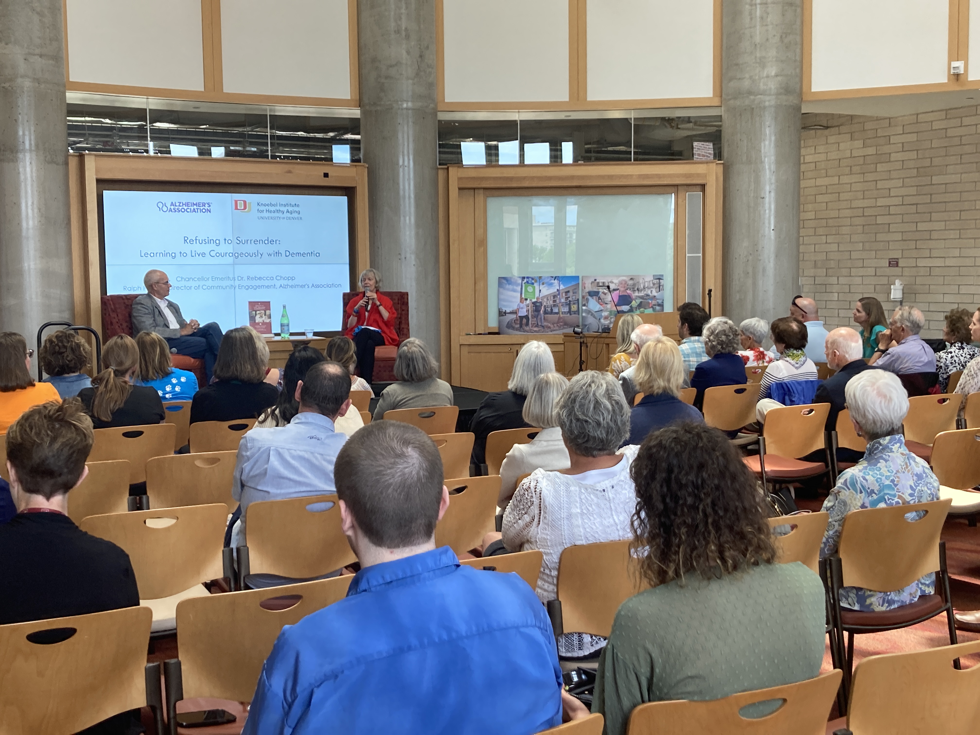 Dr. Chopp and Patrick speaking to a crowd on Alzheimer's