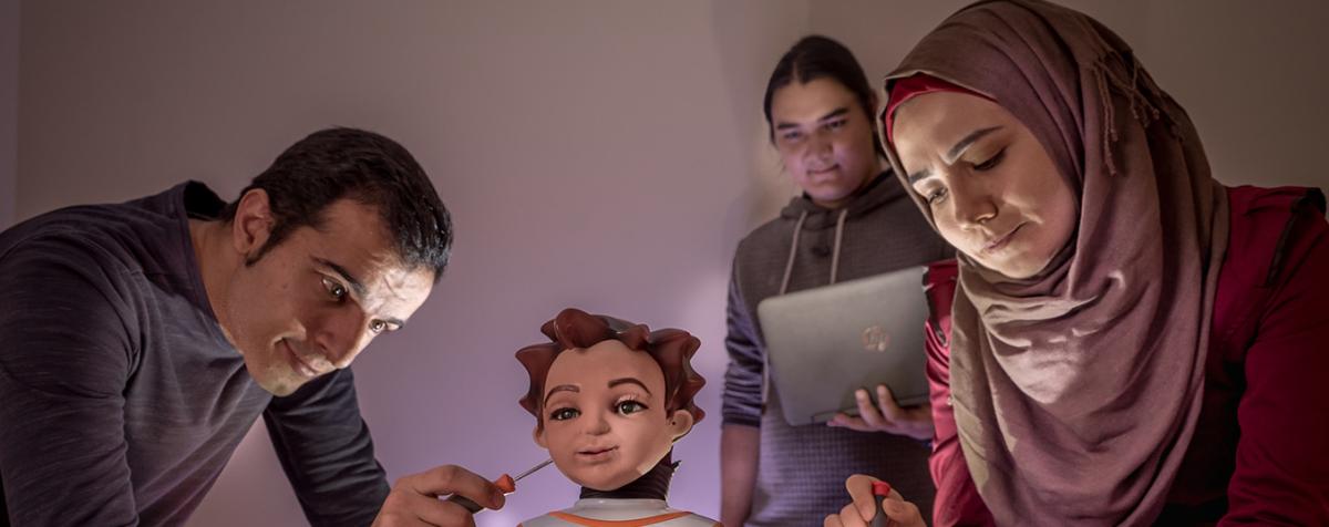 students working on robot