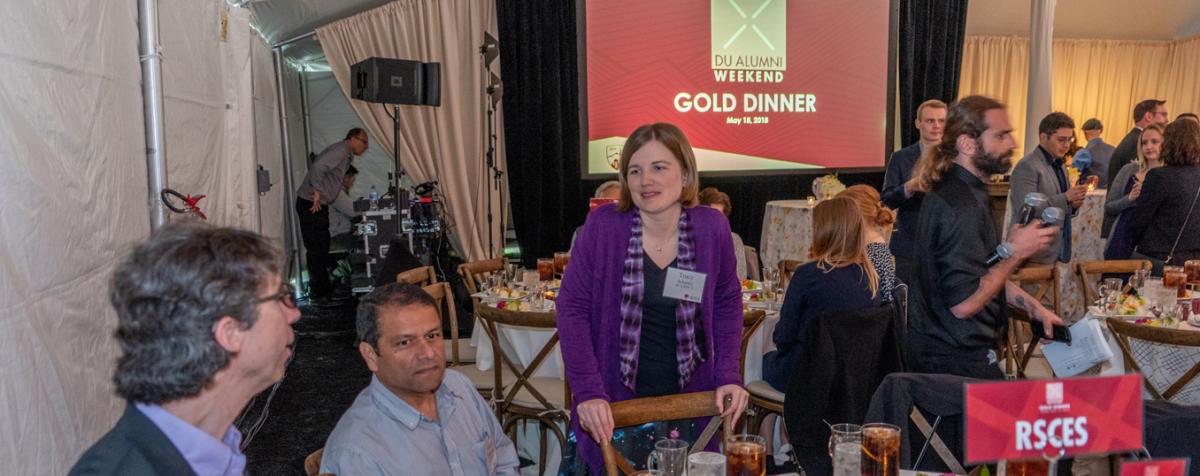 people at alumni dinner table