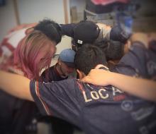 DU eSports Club members in huddle - League of Legends team