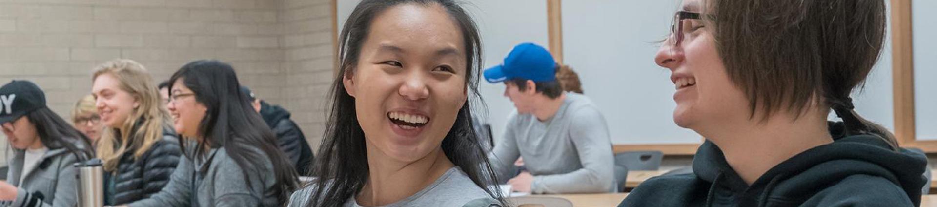 Students in class laughing